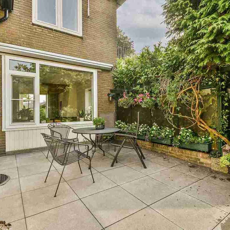 patio-with-table-and-chairs-outside-brick-house-2026-03-18-13-44-44-utc_11zon colored concrete patios